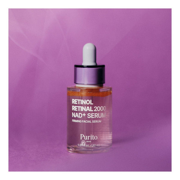 Purito Seoul Retinol Retinal 2000 NAD+ Serum 30 ml, frasco sobre fondo violeta